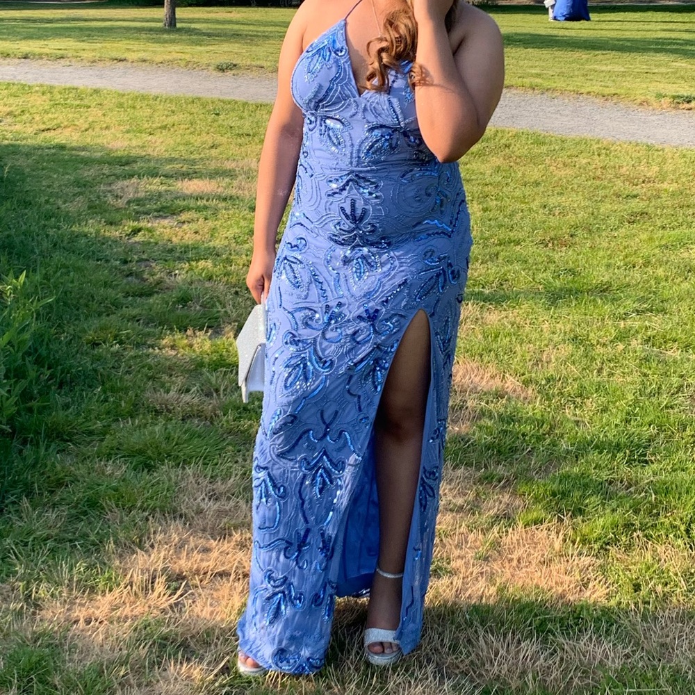 A beautiful periwinkle blue dress with slit and beaded details.